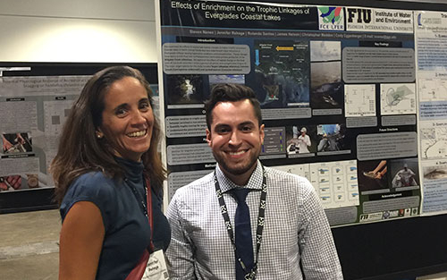 Steven Nanez (FCE LTER REU student, right) with mentor Dr. Jennifer Rehage (left) standing in front of his poster at the American Fisheries Conference in 2017.